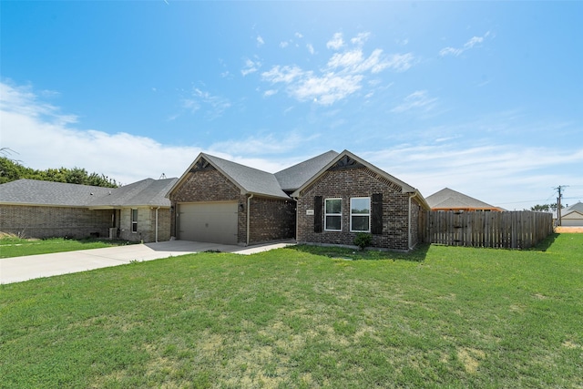 single story home featuring a front yard, a garage, fence, brick siding, and driveway