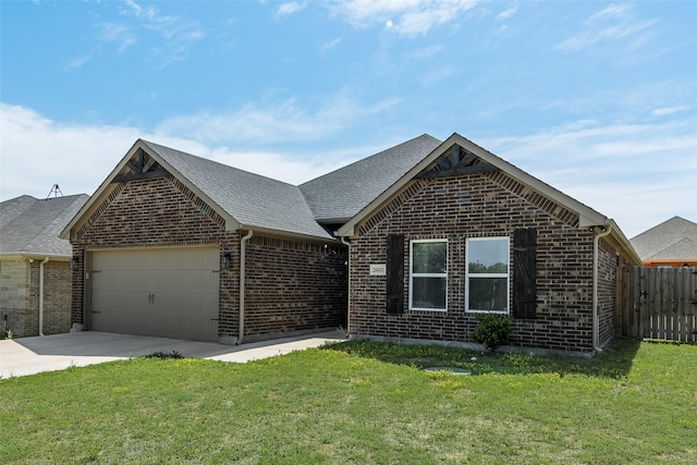 ranch-style home with concrete driveway, a front lawn, brick siding, a garage, and fence
