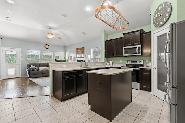 6517 Sierra Madre Dr, Fort Worth, TX 76179 - kitchen featuring open floor plan, appliances with stainless steel finishes, plenty of natural light, and ceiling fan