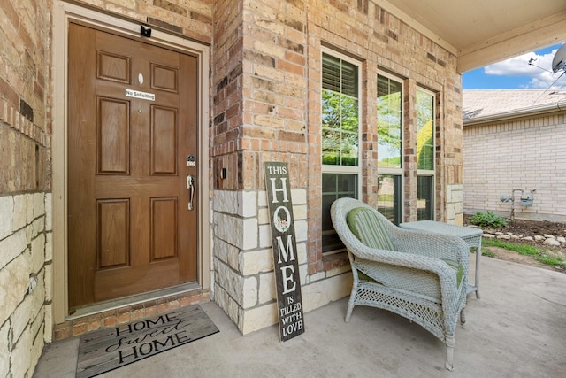6517 Sierra Madre Dr, Fort Worth, TX 76179 - doorway to property featuring brick siding and covered porch