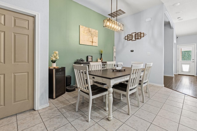 6517 Sierra Madre Dr, Fort Worth, TX 76179 - dining room with arched walkways, baseboards, and light tile patterned floors