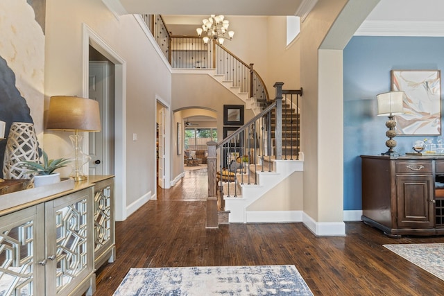 901 Moss Glen Dr, Prosper, TX 75078 - foyer entrance featuring hardwood / wood-style floors, baseboards, arched walkways, and stairs