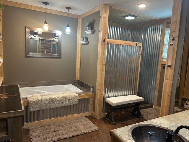 full bath featuring a garden tub and vanity