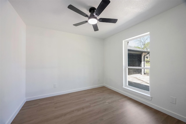 446 Silver Creek Dr, Duncanville, TX 75137 - unfurnished room featuring wood finished floors, baseboards, and ceiling fan