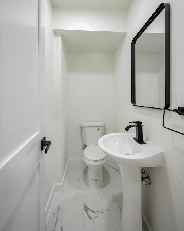 446 Silver Creek Dr, Duncanville, TX 75137 - half bath featuring marble look tile flooring and toilet
