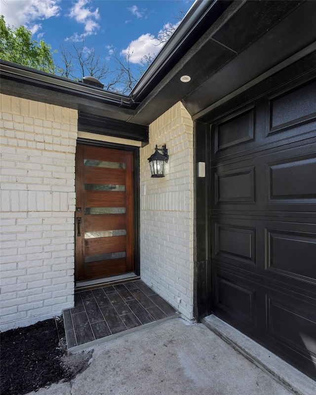 446 Silver Creek Dr, Duncanville, TX 75137 - doorway to property with brick siding and a garage