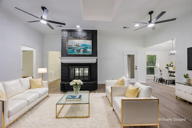 446 Silver Creek Dr, Duncanville, TX 75137 - living room with a ceiling fan, wood finished floors, a fireplace, ornamental molding, and recessed lighting