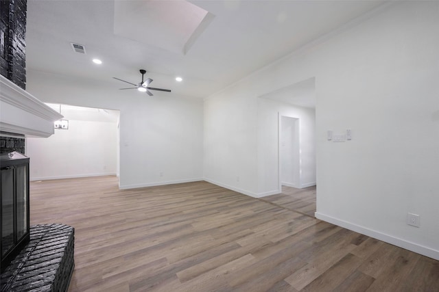 446 Silver Creek Dr, Duncanville, TX 75137 - unfurnished living room with light wood-style flooring, a ceiling fan, recessed lighting, baseboards, and a glass covered fireplace