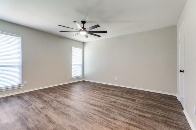 bathroom featuring a shower stall, vanity, baseboards, toilet, and tile patterned flooring