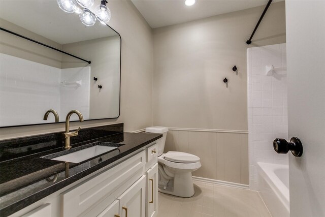 spare room with baseboards, dark wood-style flooring, and a healthy amount of sunlight