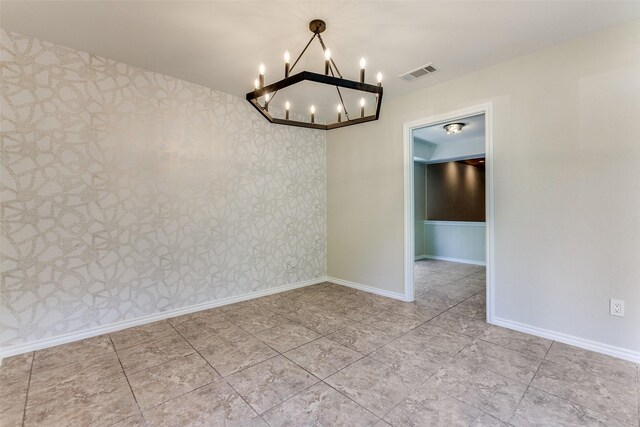 kitchen with a sink, a raised ceiling, appliances with stainless steel finishes, and tasteful backsplash