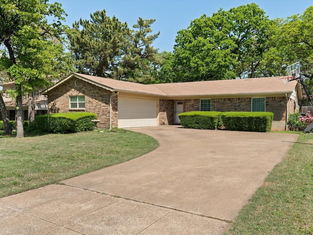 single story home featuring an attached garage, driveway, a front lawn, and brick siding
