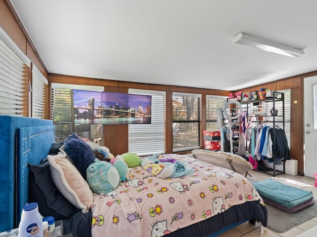 tiled bedroom with multiple windows