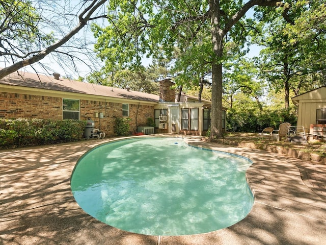 pool featuring a patio area