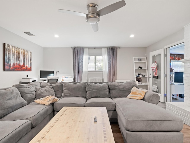 living room with recessed lighting, a ceiling fan, wood finished floors, and visible vents