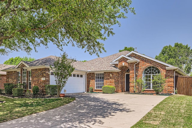 ranch-style house with a garage, driveway, and brick siding