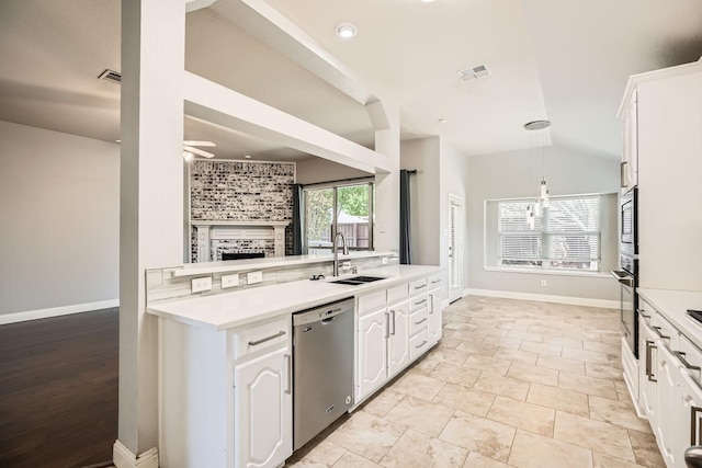 kitchen with ceiling fan, visible vents, appliances with stainless steel finishes, a sink, and white cabinets