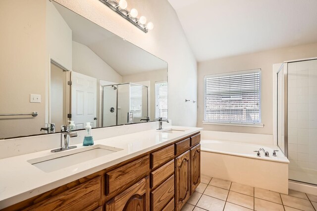 bathroom featuring a sink, a bath, lofted ceiling, and a shower stall