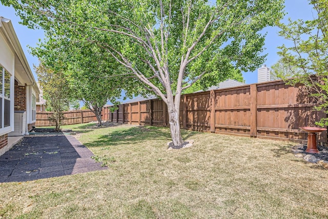view of yard featuring a fenced backyard