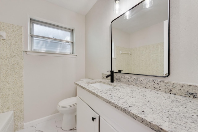 full bath featuring vanity, baseboards, toilet, a washtub, and a shower
