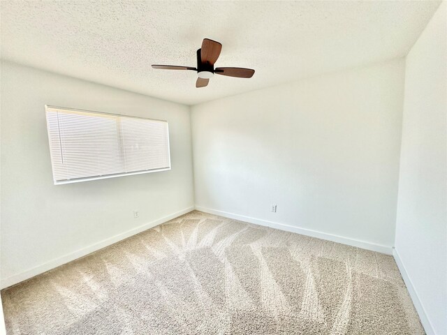 10035 Everton Pl, Dallas, TX 75217 - empty room with a textured ceiling, ceiling fan, baseboards, and carpet