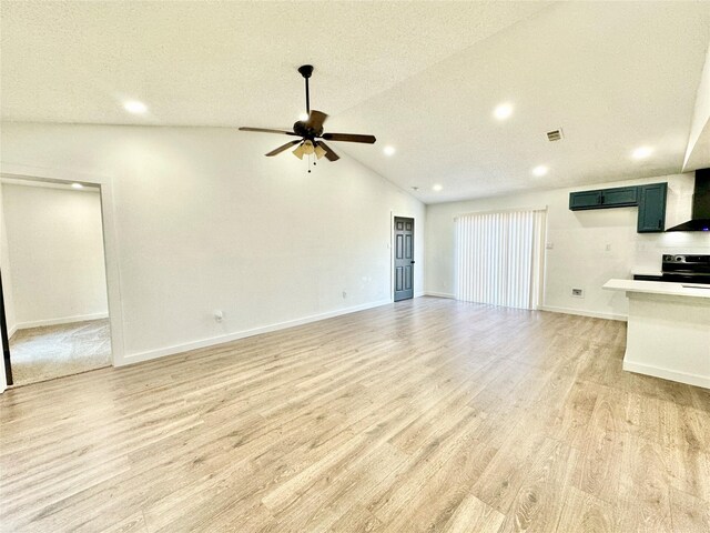 10035 Everton Pl, Dallas, TX 75217 - unfurnished living room featuring visible vents, ceiling fan, light wood-style floors, recessed lighting, and vaulted ceiling