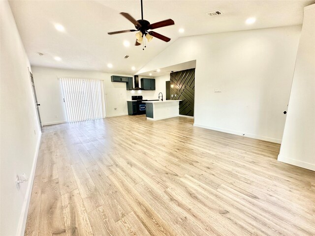 10035 Everton Pl, Dallas, TX 75217 - unfurnished living room featuring vaulted ceiling, recessed lighting, light wood-style flooring, a ceiling fan, and visible vents