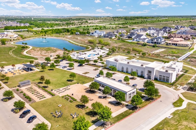 bird's eye view with a water view and a residential view