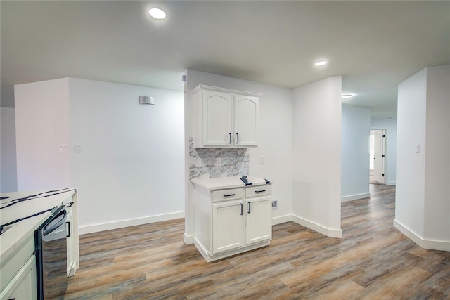 2023 Lake Trail Dr, Heartland, TX 75126 - kitchen with light countertops, light wood-style floors, white cabinetry, and baseboards