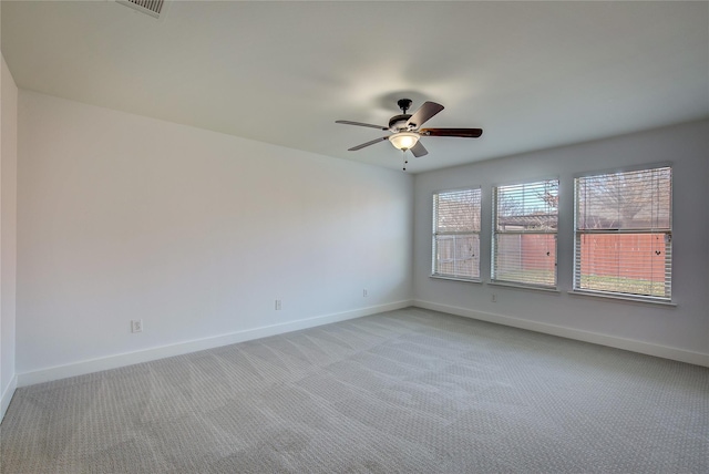 2023 Lake Trail Dr, Heartland, TX 75126 - spare room featuring light carpet, visible vents, baseboards, and ceiling fan