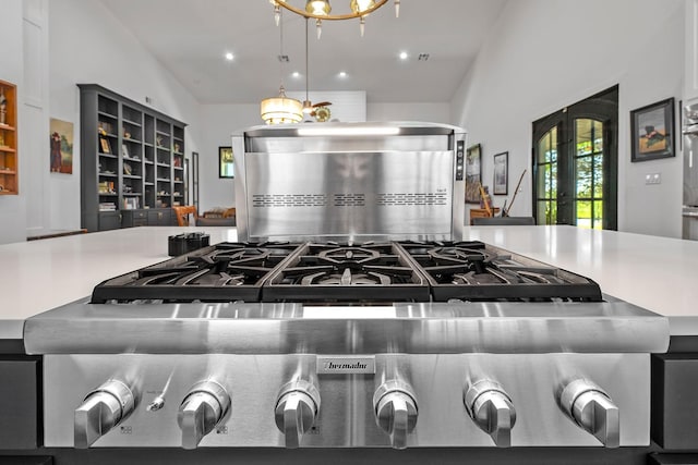 interior space featuring french doors, stove, and recessed lighting