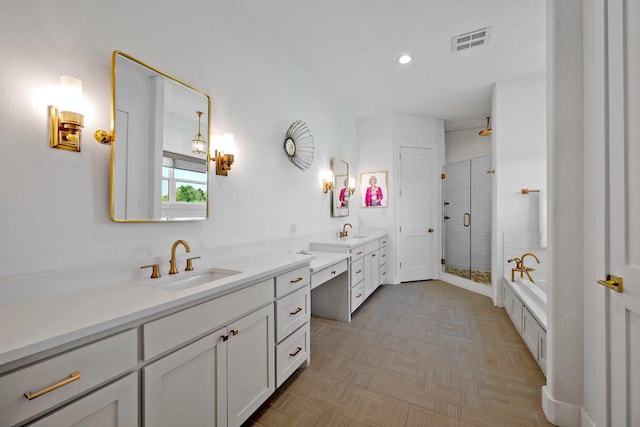 full bath featuring a sink, double vanity, a shower stall, visible vents, and a bath