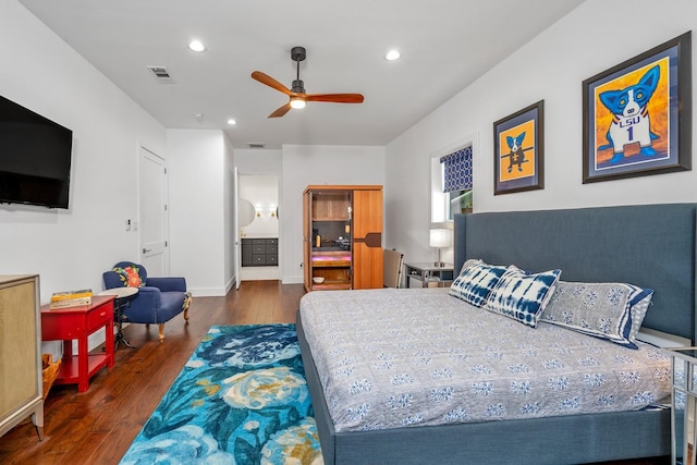 bedroom featuring recessed lighting, visible vents, wood finished floors, and ensuite bath