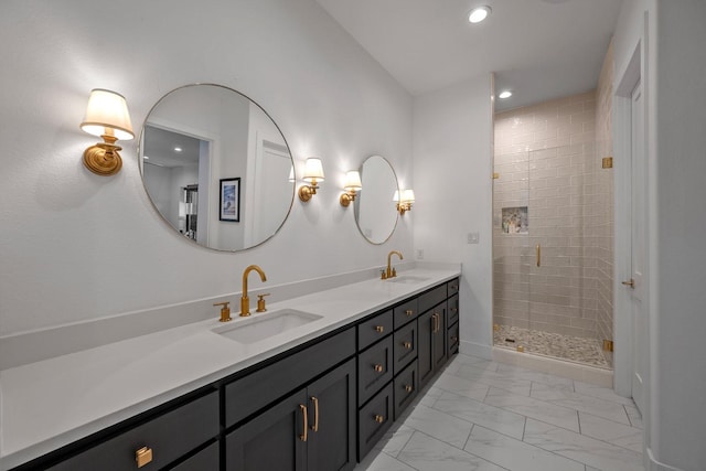 full bath featuring a sink, a stall shower, recessed lighting, and marble finish floor