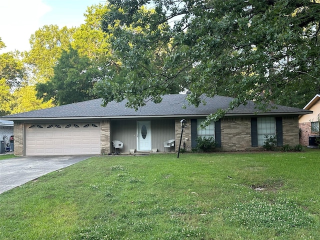 ranch-style home with an attached garage, driveway, a shingled roof, and a front yard