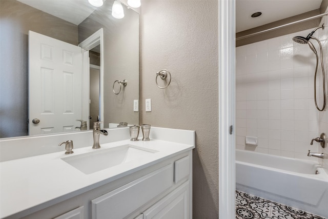 1638 Sandia Ln, Frisco, TX 75033 - full bath featuring vanity, tub / shower combination, a textured wall, and tile patterned flooring