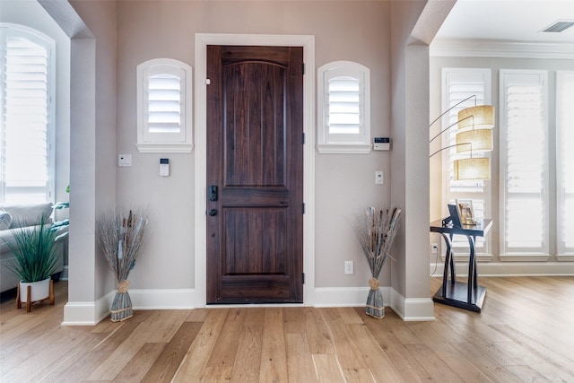 1638 Sandia Ln, Frisco, TX 75033 - foyer with light wood finished floors and crown molding