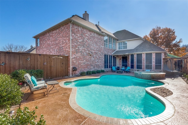 1638 Sandia Ln, Frisco, TX 75033 - view of pool with a patio area, a fenced backyard, a pool with connected hot tub, and a gate