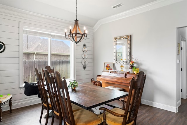 7423 Morning Glory Rd, Abilene, TX 79602 - dining room with a chandelier, crown molding, dark wood-type flooring, and baseboards