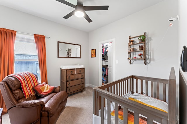 7423 Morning Glory Rd, Abilene, TX 79602 - carpeted bedroom featuring a ceiling fan, a closet, baseboards, and a walk in closet