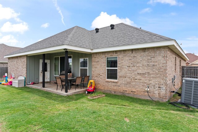7423 Morning Glory Rd, Abilene, TX 79602 - rear view of property with roof with shingles, brick siding, central air condition unit, a patio area, and board and batten siding