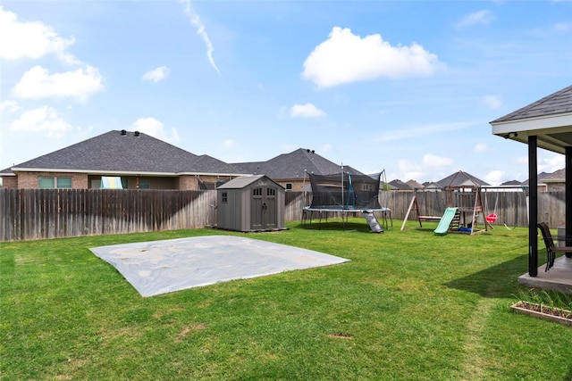 7423 Morning Glory Rd, Abilene, TX 79602 - view of yard with a storage unit, a playground, a trampoline, a patio, and an outdoor structure