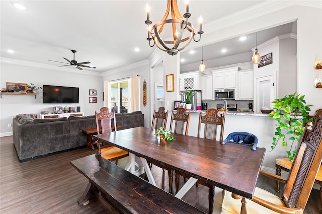 7423 Morning Glory Rd, Abilene, TX 79602 - dining room with recessed lighting, dark wood-type flooring, ceiling fan, ornamental molding, and a chandelier