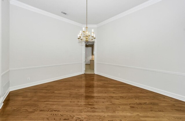 824 Parkwood Ct, Mckinney, TX 75072 - spare room featuring a chandelier, ornamental molding, baseboards, and wood finished floors