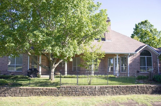824 Parkwood Ct, Mckinney, TX 75072 - view of front of home with brick siding, a chimney, and a shingled roof