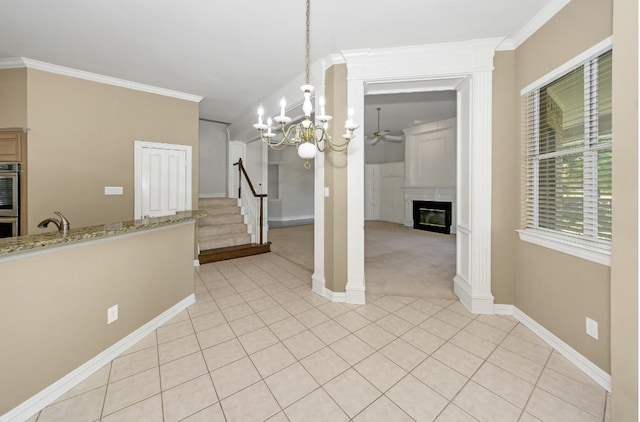824 Parkwood Ct, Mckinney, TX 75072 - unfurnished dining area with a ceiling fan, a glass covered fireplace, baseboards, stairway, and light tile patterned floors