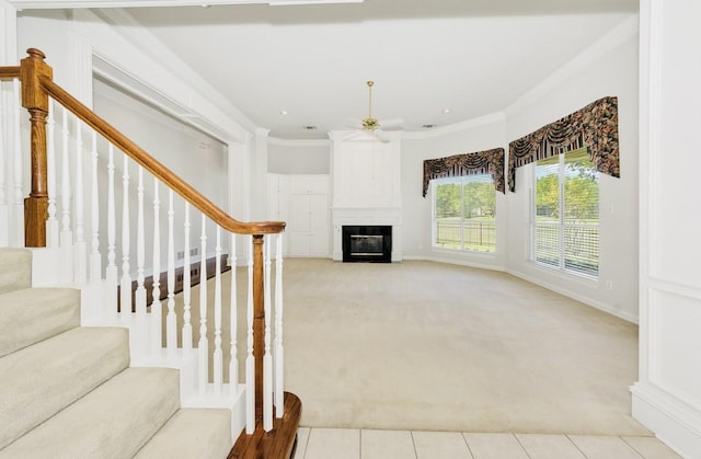 824 Parkwood Ct, Mckinney, TX 75072 - stairway with a ceiling fan, carpet flooring, a large fireplace, and ornamental molding