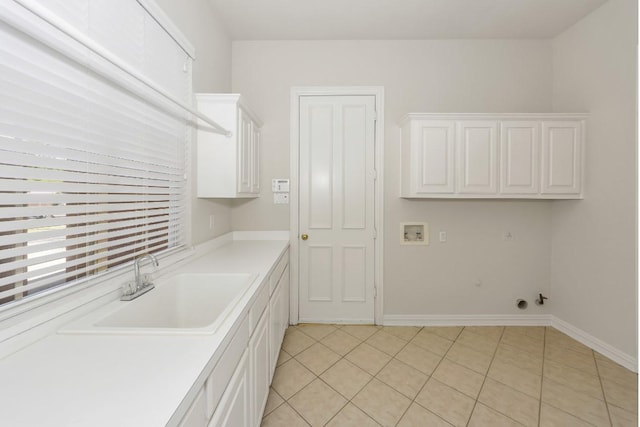 824 Parkwood Ct, Mckinney, TX 75072 - washroom with cabinet space, light tile patterned floors, hookup for a washing machine, gas dryer hookup, and baseboards
