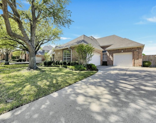 824 Parkwood Ct, Mckinney, TX 75072 - view of front of home with an attached garage, brick siding, driveway, and roof with shingles