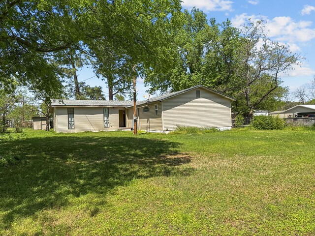 281 Seminole Dr, Gordonville, TX 76245 - rear view of house with a lawn